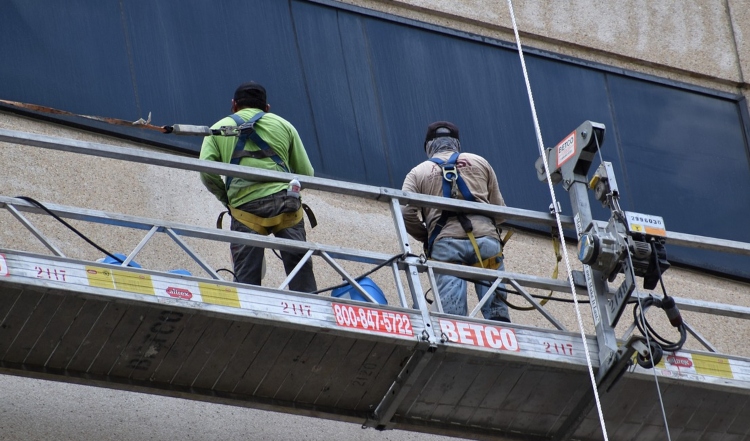 Workers using a fall restraint system